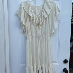 Ivory dress with ruffles around neckline